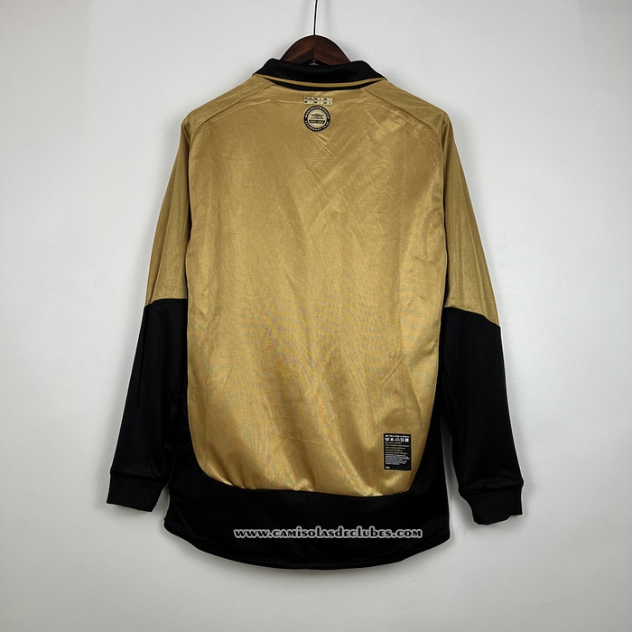 Camisola
 Manchester United Retro 2001-2002 Manga Comprida
 Ponerse En Doble Cara